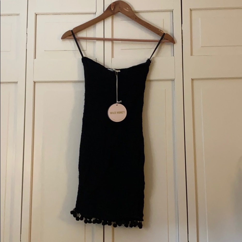 Strapless Black body con dress with Pom poms